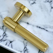 Satin brass knurled door handles